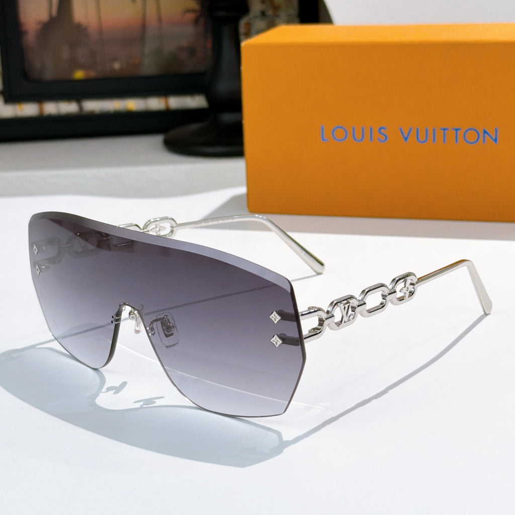 Louis Vuitton sunglasses with dark gray gradient lenses and gold chain detail frames