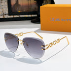 Louis Vuitton sunglasses with gold-tone frames and deep gray gradient lenses