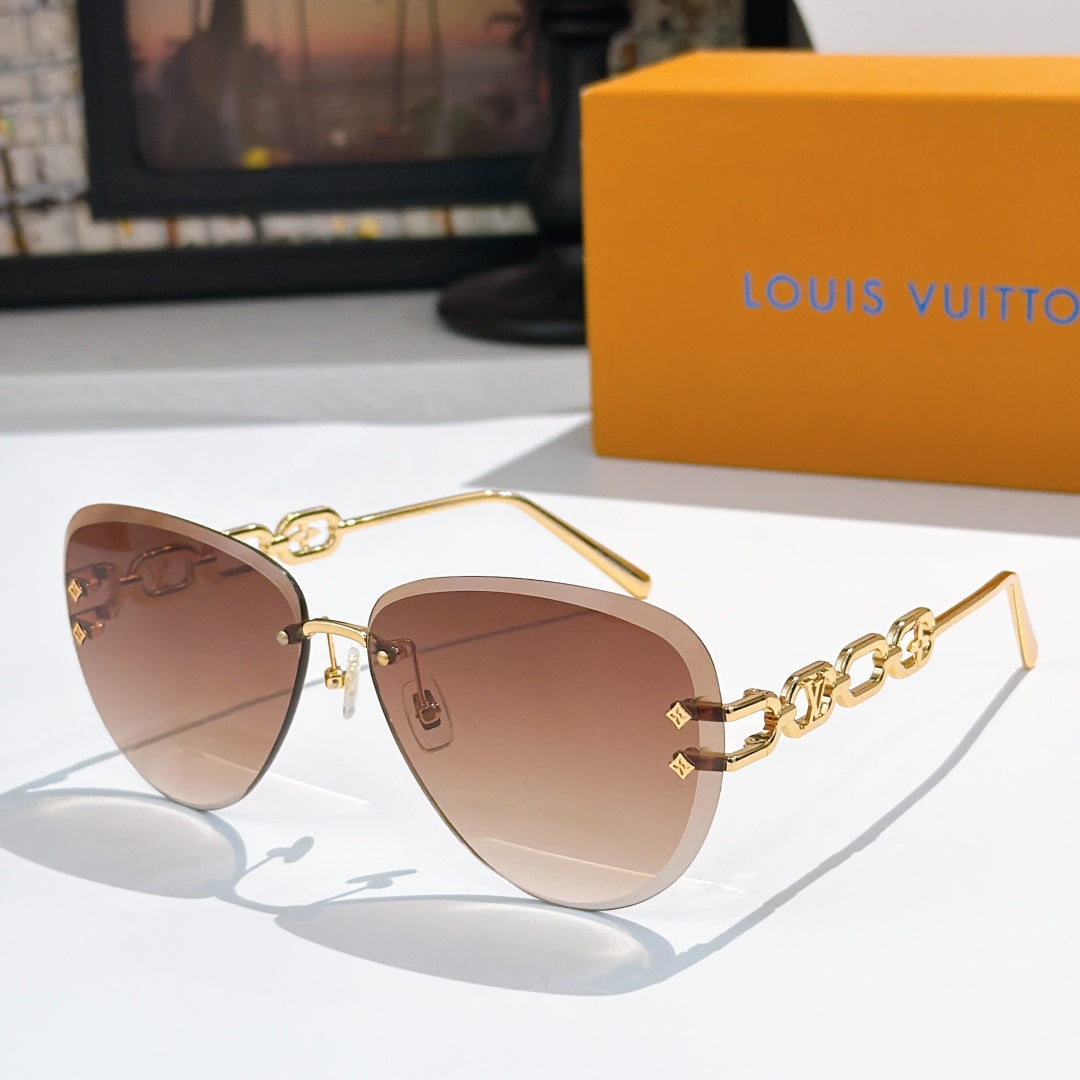 Louis Vuitton sunglasses with gold-tone frames and warm brown gradient lenses