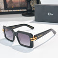 Dior square sunglasses, dark frames with gold bar and purple-tinted lenses