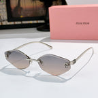 MiuMiu cat-eye sunglasses with silver frame and light gradient lenses