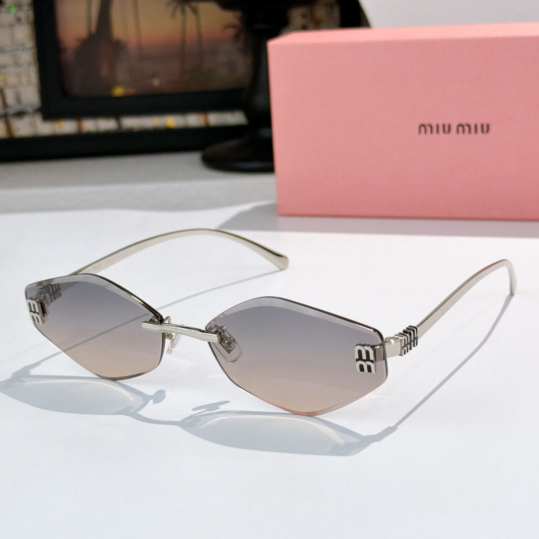 MiuMiu cat-eye sunglasses with silver frame and light gradient lenses