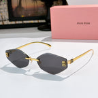 MiuMiu cat-eye sunglasses with gold frame and black-tinted lenses