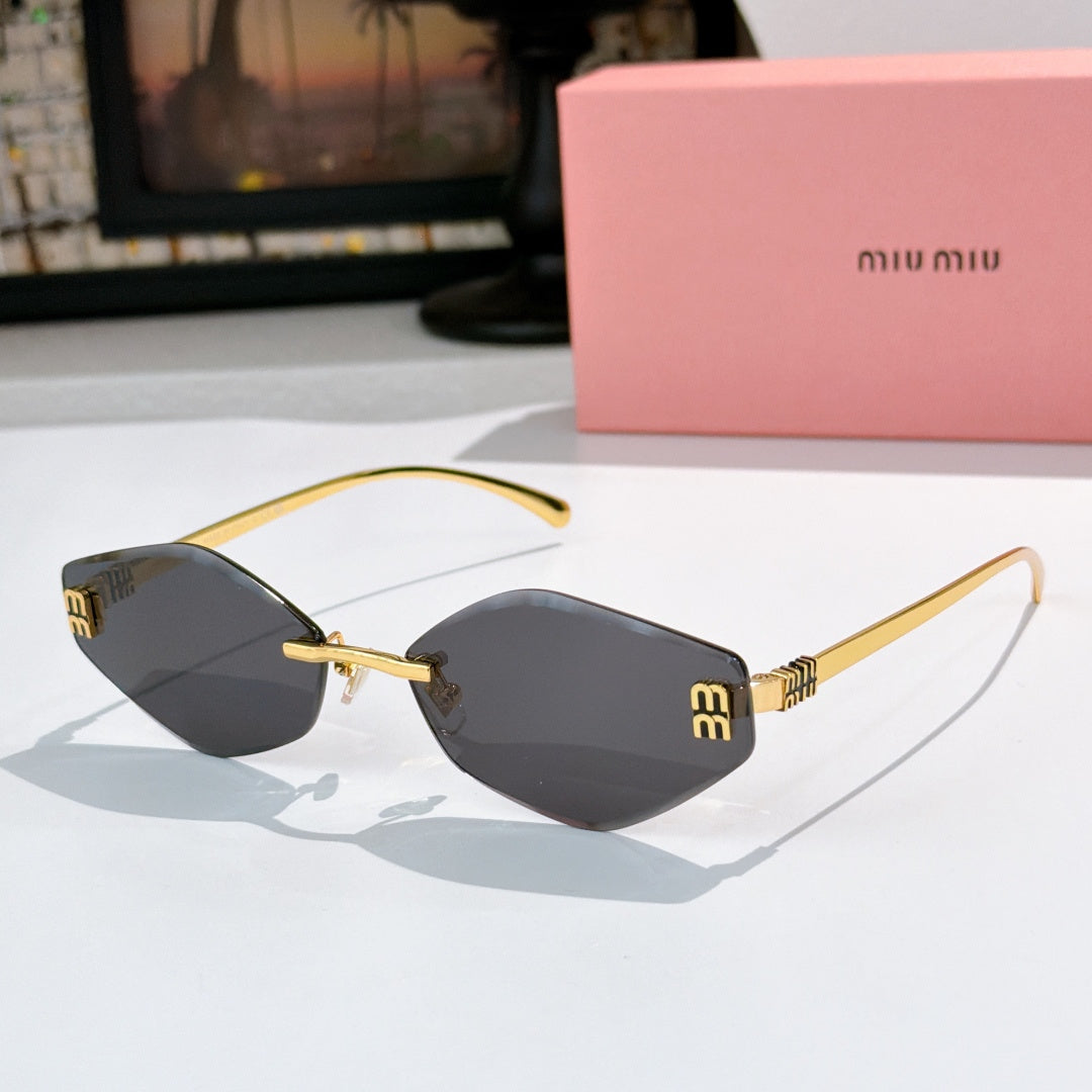 MiuMiu cat-eye sunglasses with gold frame and black-tinted lenses
