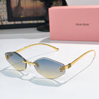 MiuMiu cat-eye sunglasses with gold frame and blue gradient lenses