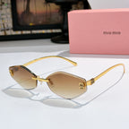 MiuMiu cat-eye sunglasses with gold frame and tan gradient lenses