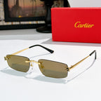 Gold-rim glasses with tan lenses, black temple arms, and ornate bridge detail