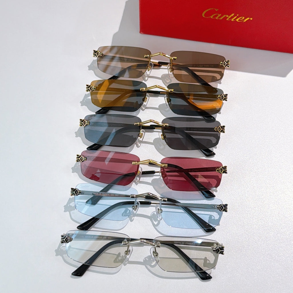 Assorted gold frame glasses with tinted lenses in brown, blue, and red shades