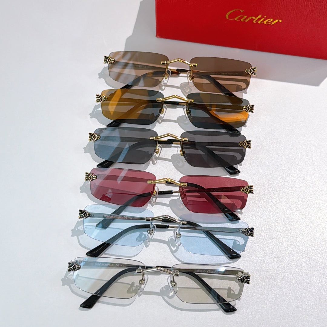 Assorted gold frame glasses with tinted lenses in brown, blue, and red shades