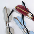 Set of glasses with metal frames and colored lenses, including light blue and burgundy