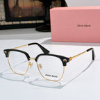 MiuMiu eyeglasses with tortoiseshell frame and gold-tone detailing, clear lenses