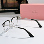 MiuMiu eyeglasses with black full-rim frame and clear lenses, side profile