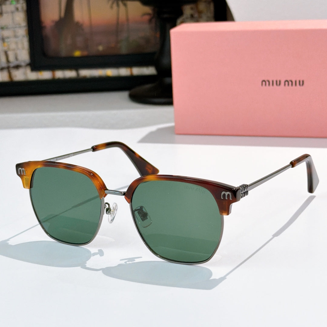 Sunglasses with green lenses and tortoiseshell frame, gold-toned hinges, logo detail on temples