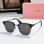 Sunglasses with dark gray lenses and black frame, silver-toned hinges, logo detail on temples