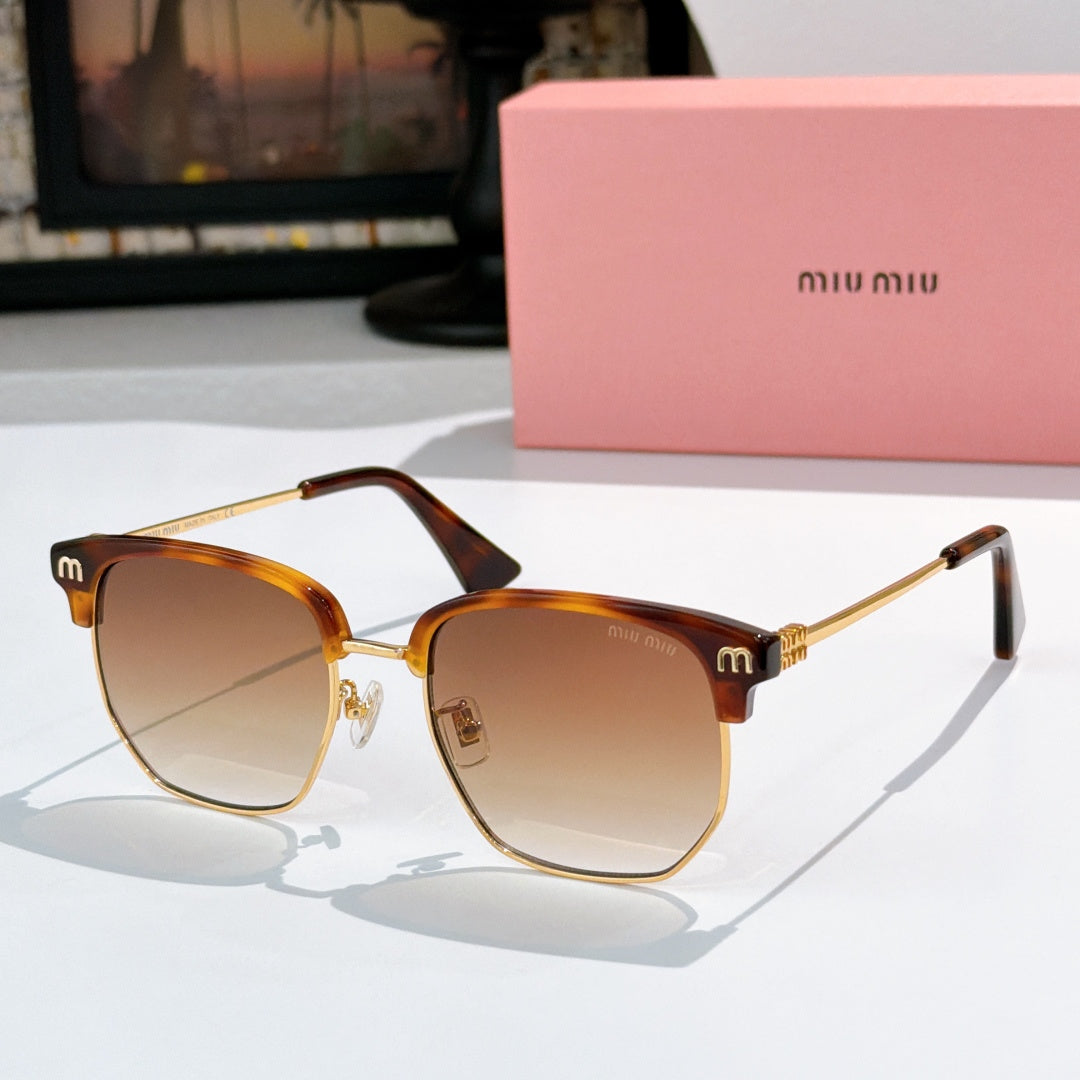 Sunglasses with brown lenses and tortoiseshell frame, gold-toned hinges, logo detail on temples