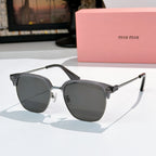 Sunglasses with dark gray lenses and clear dark frame, logo detail on temples, metal hinges