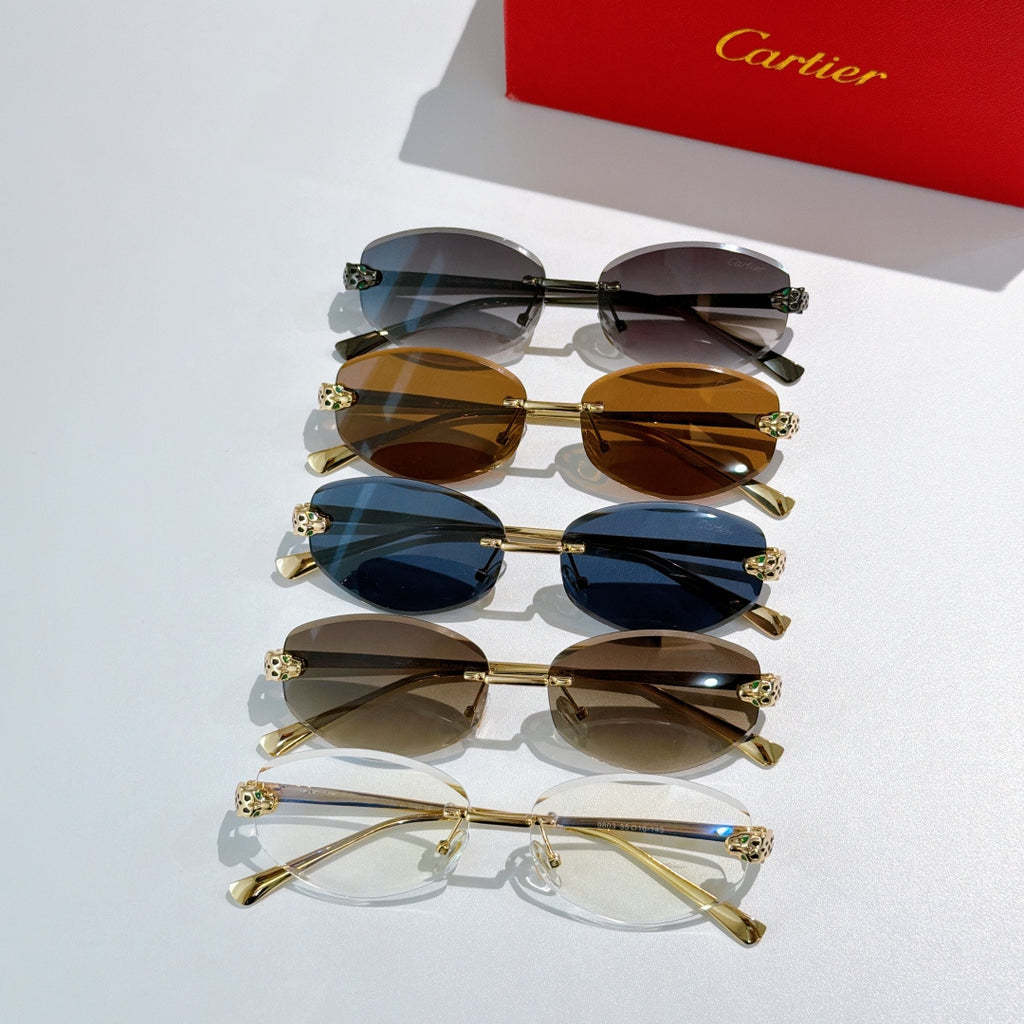 Cartier sunglasses set with gold frames and leopard temple accents, mixed lens colors.