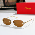 Cartier round sunglasses with gold frames, amber lenses, leopard-pattern temples.