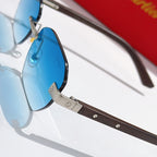 Cartier blue-tinted sunglass lens with gold-tone frame and dark brown temple