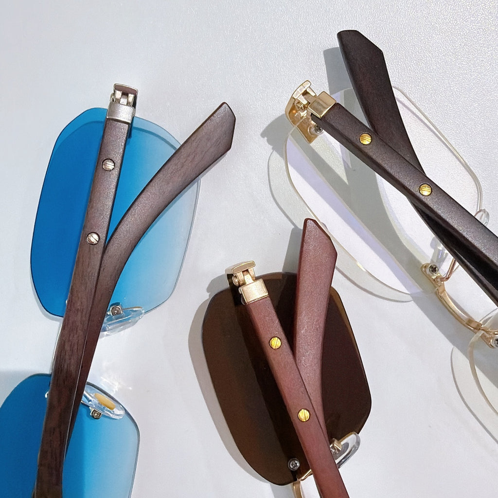 Cartier sunglasses collection with blue-tinted lenses and dark brown frames