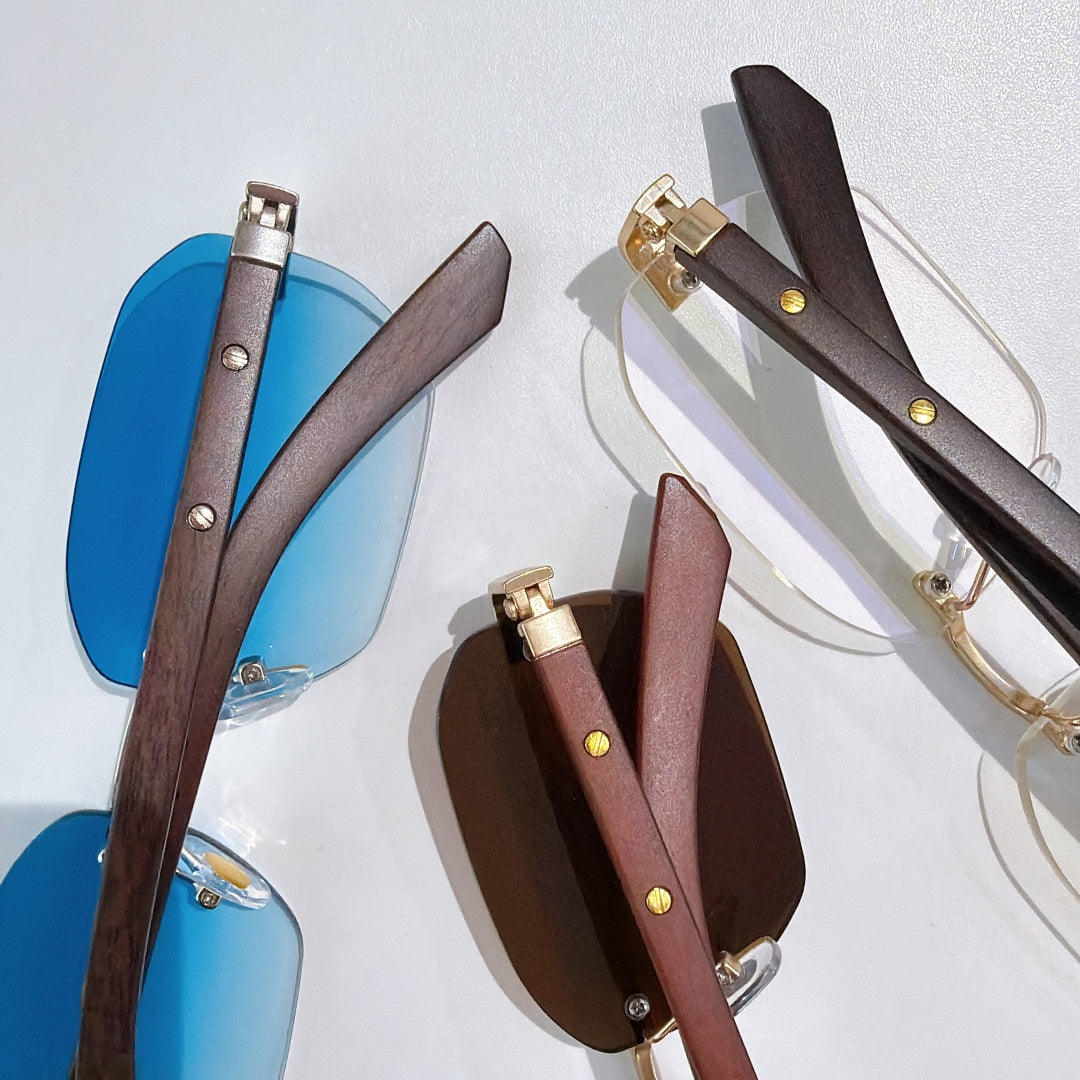 Cartier sunglasses collection with blue-tinted lenses and dark brown frames