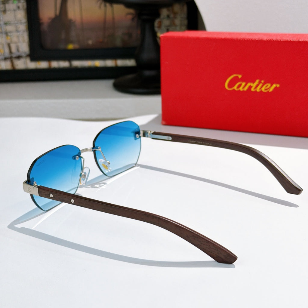 Cartier blue-tinted sunglasses in side view with gold-tone frame and brown temples