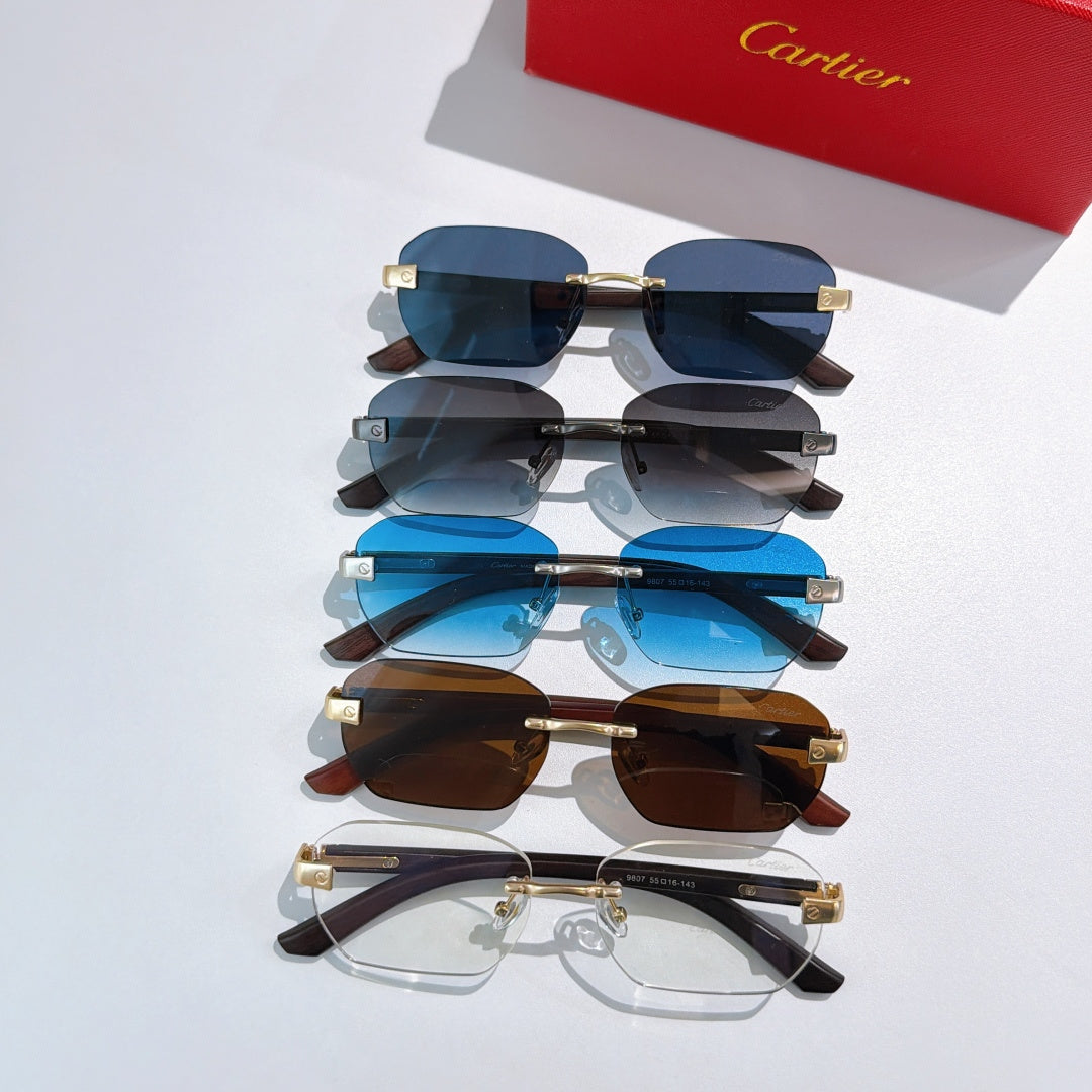 Cartier sunglasses and glasses set with blue, dark, brown lenses, and clear frames