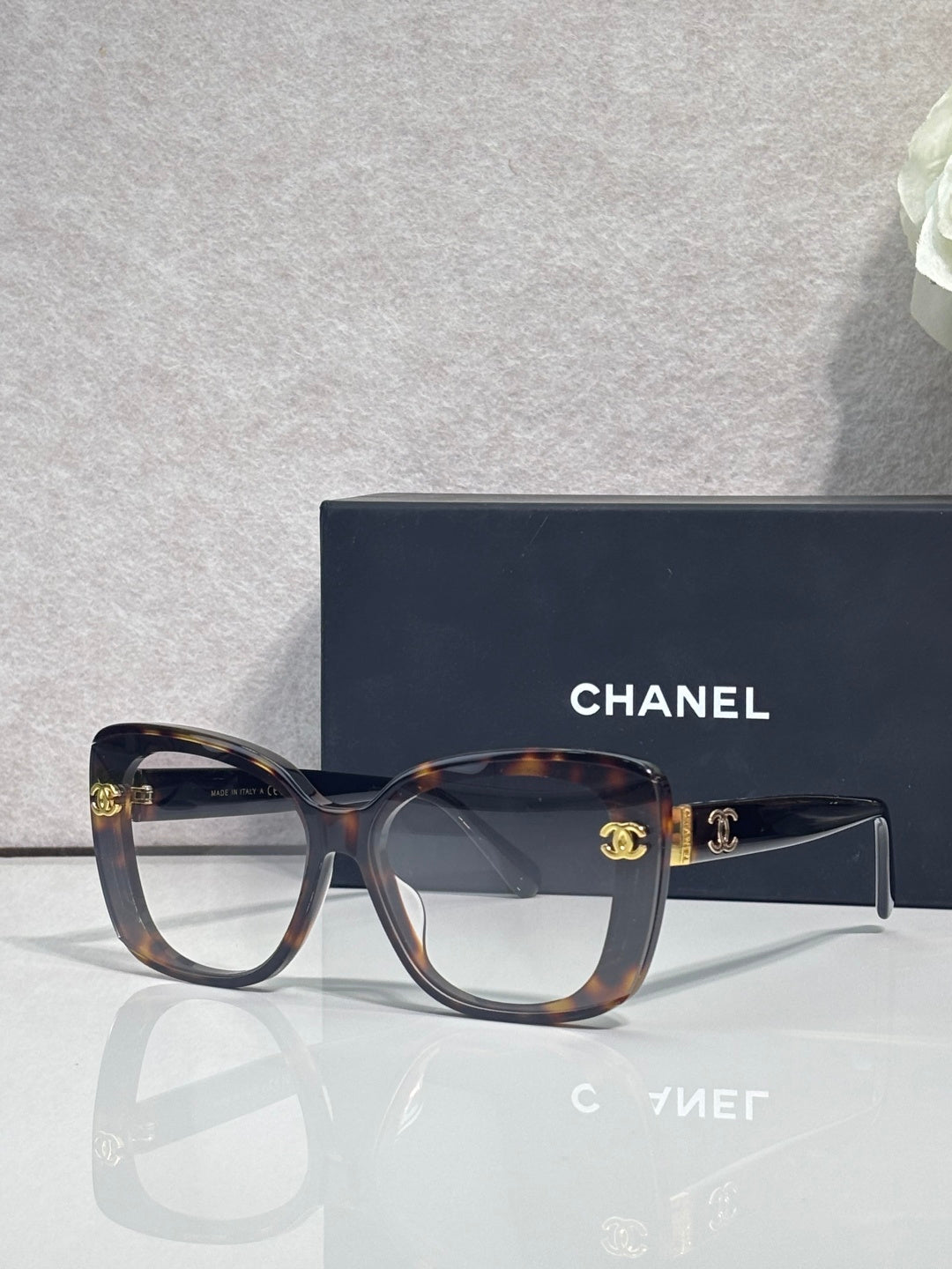 Chanel sunglasses with tortoiseshell frames and dark temples, gradient lenses