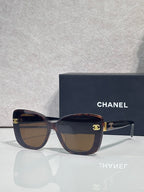 Chanel sunglasses with tortoiseshell frames and dark temples, brown lenses