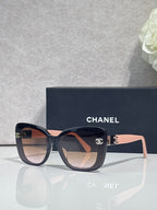 Chanel sunglasses with dark blue square frames and gradient brown lenses