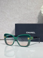 Chanel sunglasses with green frames and dark temples, gradient lenses