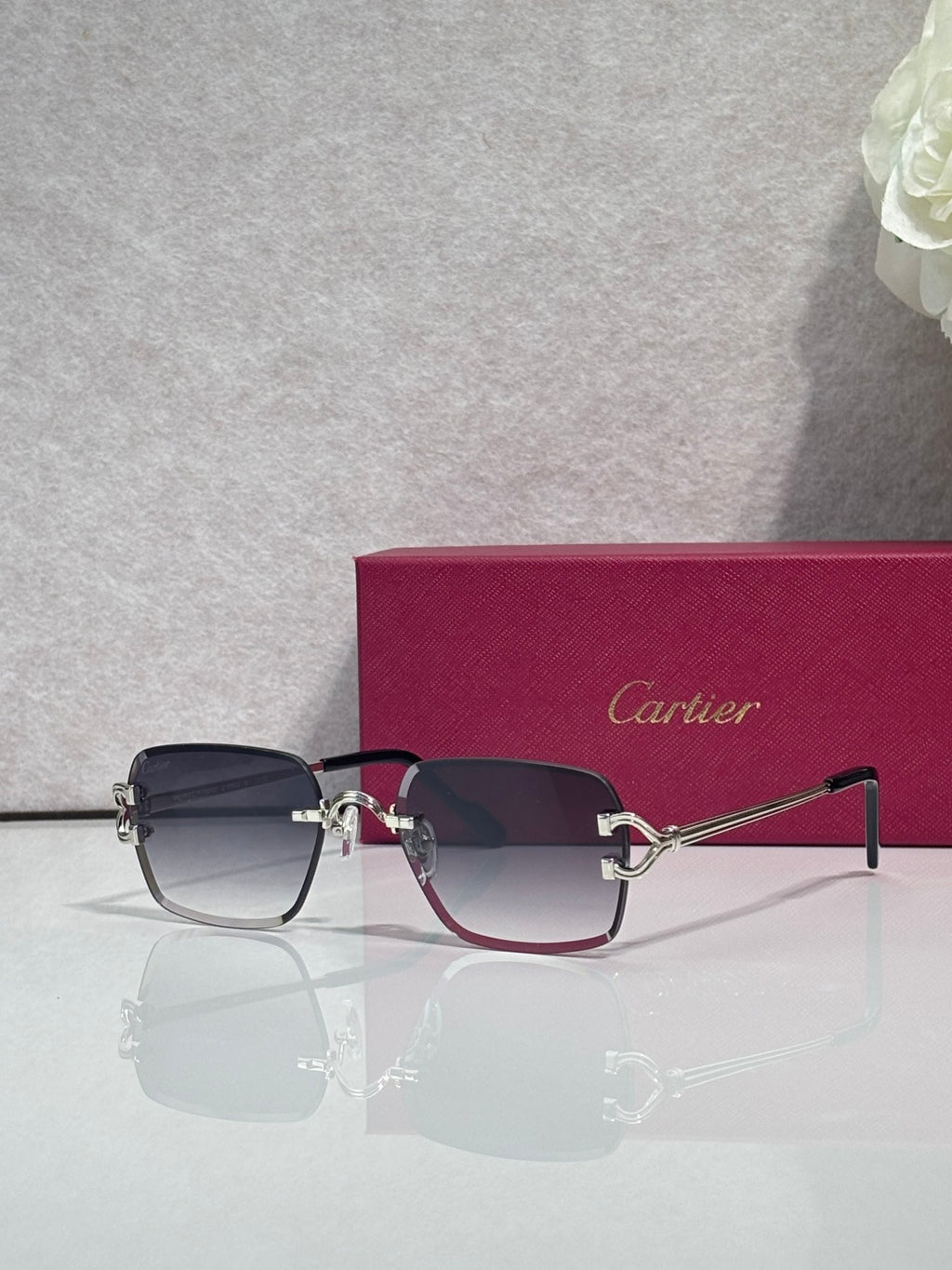 Cartier acetate eyeglasses with dark blue frame, tinted lenses, and gold-tone hinges