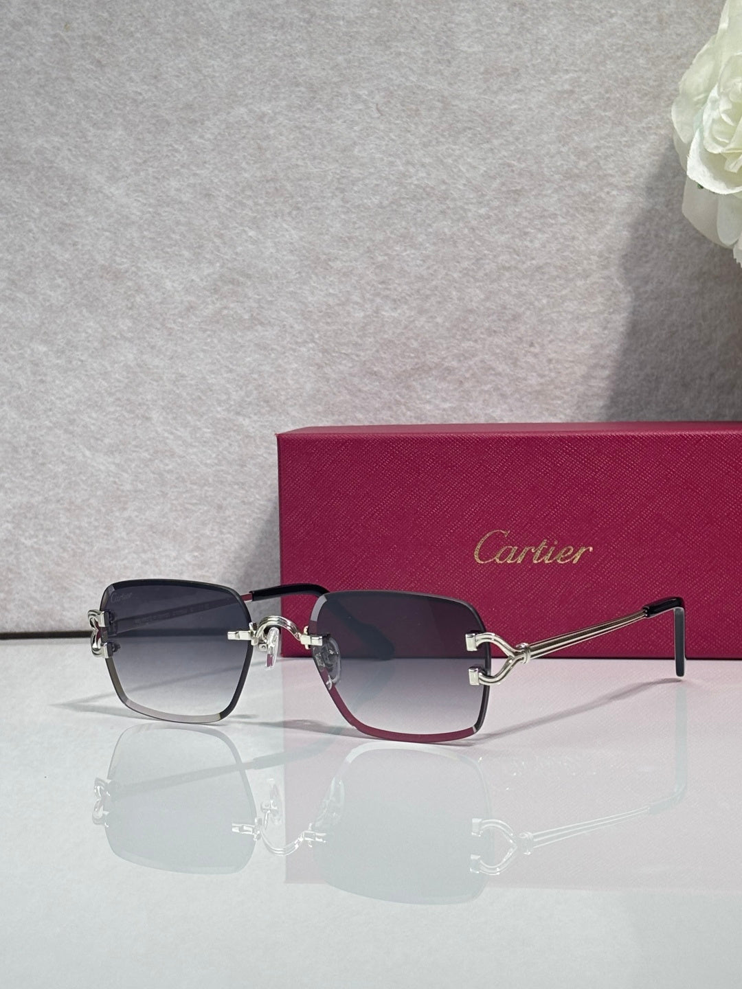 Cartier acetate eyeglasses with dark blue frame, tinted lenses, and gold-tone hinges