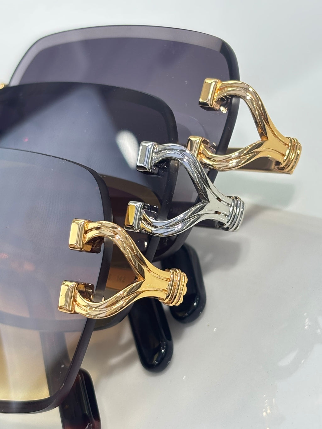 Cartier eyeglass frame close-up with gold-tone and silver-tone temple hardware