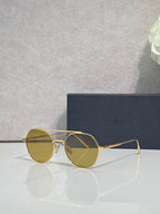Dior sunglasses with gold metal frame and amber round lenses