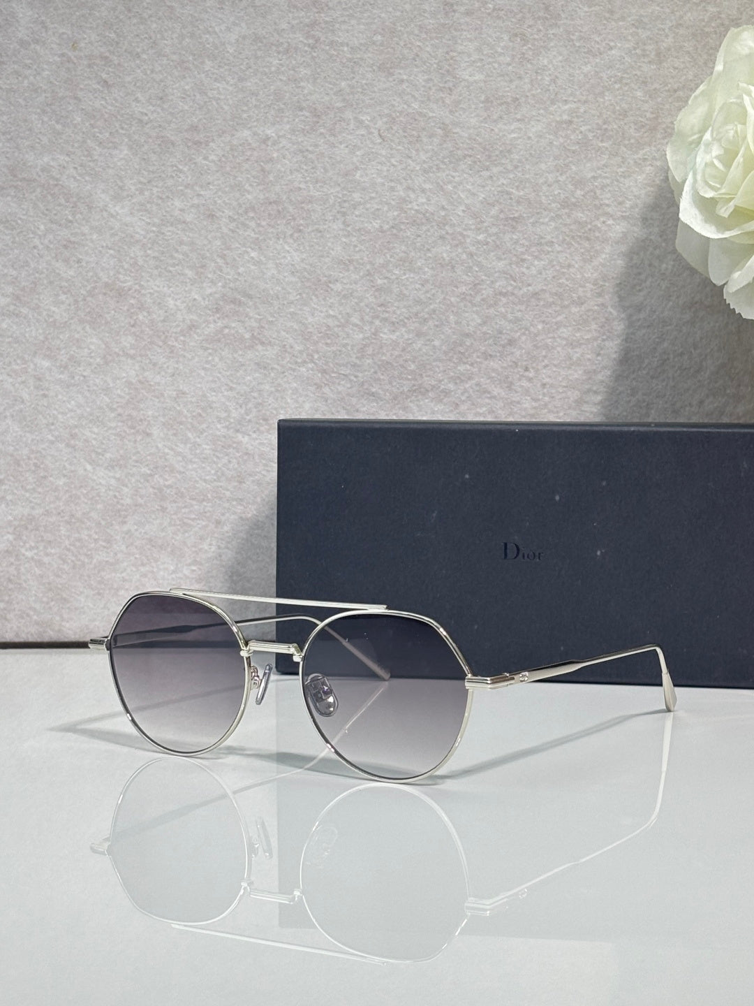 Dior sunglasses with dark lenses and silver metal round frames