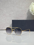 Dior sunglasses with gold metal frame and dark blue round lenses