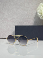 Dior sunglasses with gold metal frame and dark blue round lenses