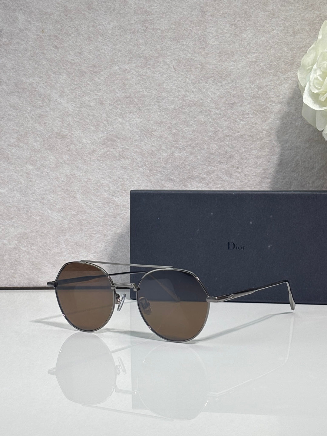 Dior sunglasses with dark lenses and silver metal round frames
