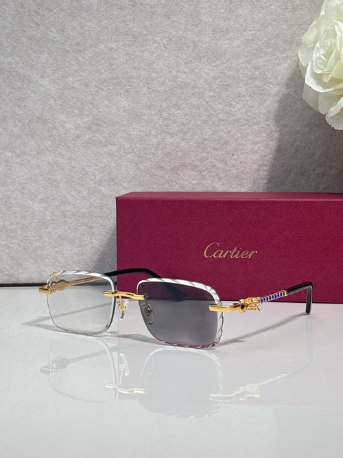 Cartier glasses with gold metal frame and dark tinted lenses, thin black temple arms