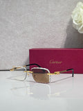 Cartier glasses with gold metal frame, dark tinted lenses, and thin black temples