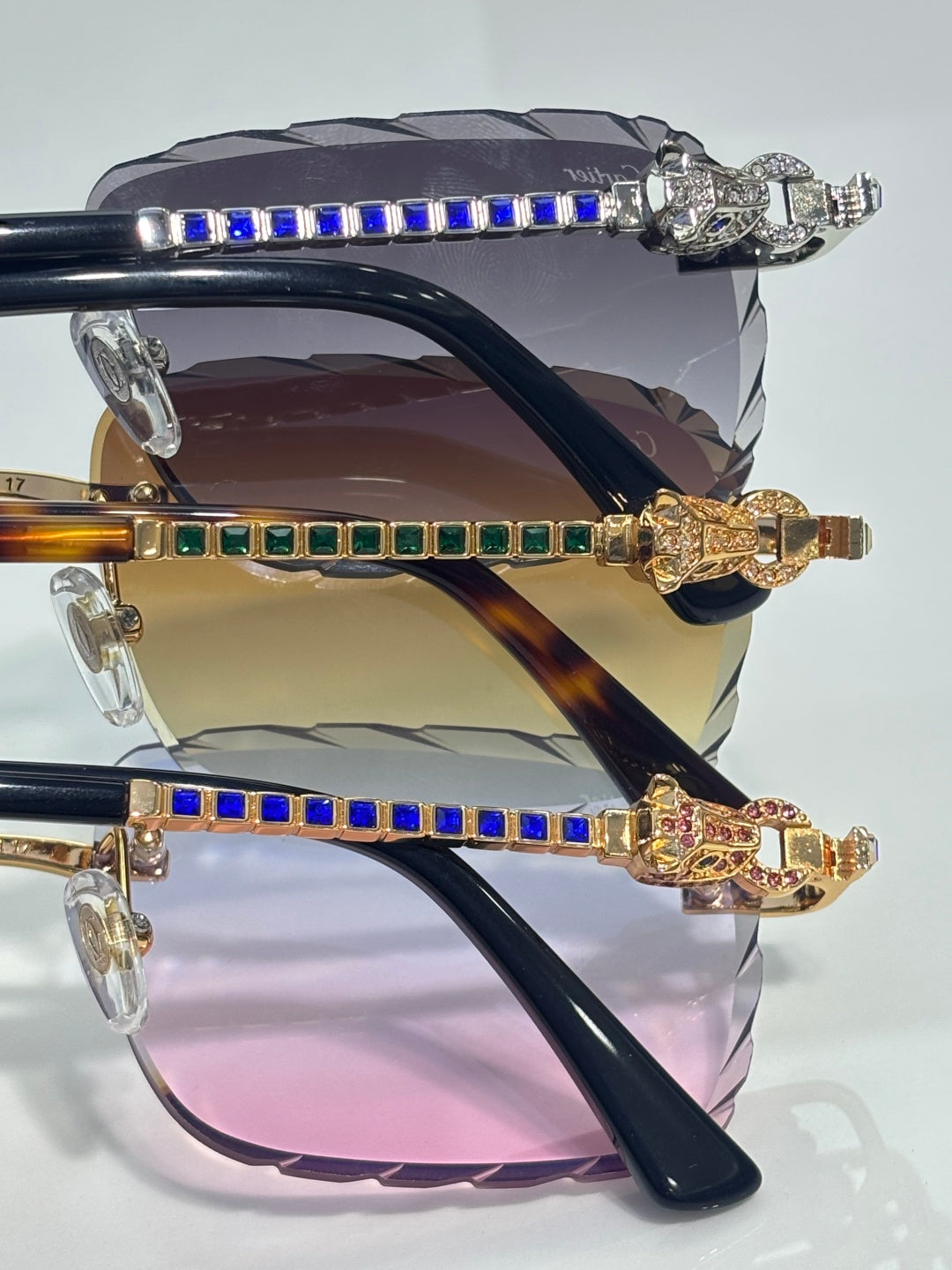 Cartier glasses showing gold hinges with blue gem-like inlays and tortoiseshell-style temples