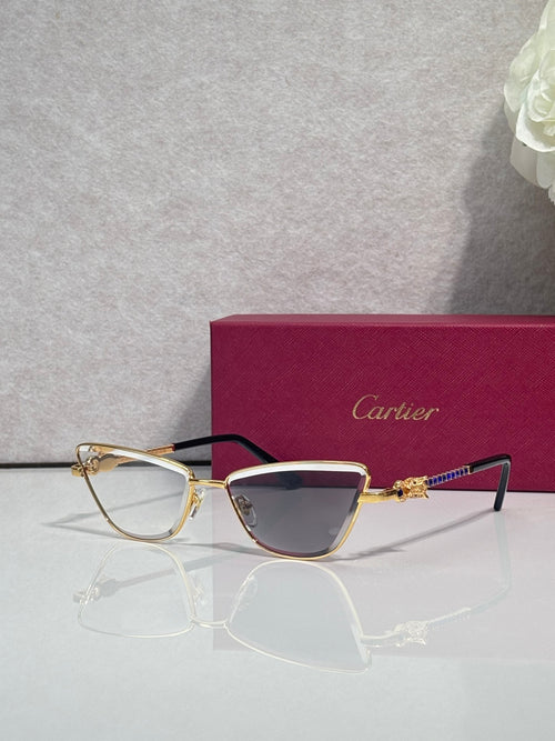Cat-eye glasses with black and gold frame, tinted lenses and decorative gold temple details