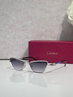 Cat-eye glasses with black frame and silver-tone temples, dark tinted lenses and jeweled accents