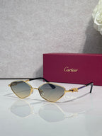 Cartier glasses with gold-tone frame, light gray lenses, and black temple tips.