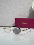 Cartier glasses with gold-tone frame, dark gray lenses, and black temples.