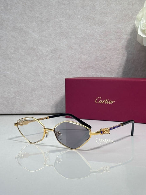 Cartier glasses with gold-tone frame, dark gray lenses, and black temples.