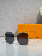 Louis Vuitton square sunglasses with deep blue-tinted lenses and gold-tone frame