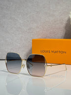 Louis Vuitton square sunglasses with smoke-tinted lenses and gold-tone frame