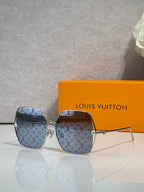 Louis Vuitton monogram square sunglasses with blue patterned frame and tinted lenses